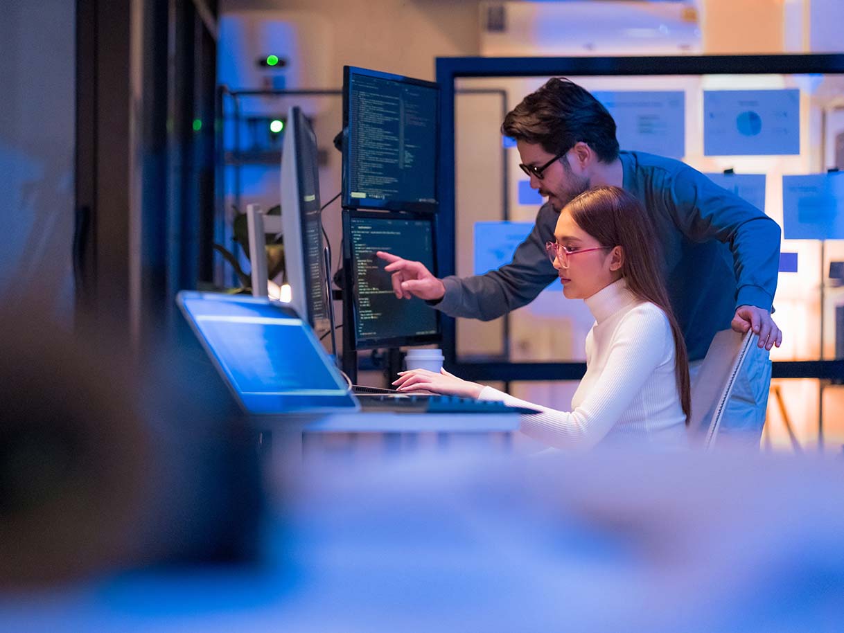 colleagues looking at laptop