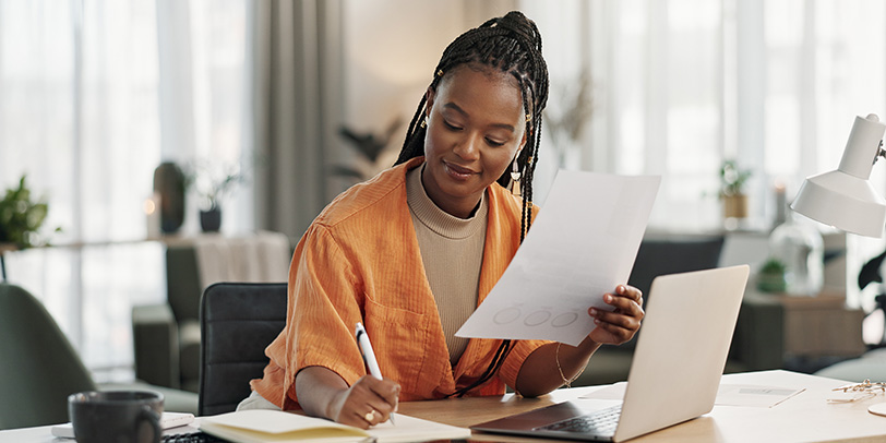 Woman writing at desk